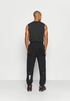 Jordan ZION WILLIAMSON PANT - Pantalon de survêtement Prix Allégé vêtements basket-ball homme -Jordan Soldes Boutique 56a5aa5c4ae24a0c8c3ff927e2afa159